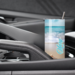 Car cup holder with personalized seashell beach tumbler inside
